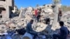 People search the rubble for missing persons at the site of an Israeli strike a day earlier that hit the Al-Loh family home in Beit Lahia, in the northern Gaza Strip on Oct. 30, 2024.