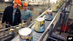FILE — In this March 23, 2010 file photo ice cream moves along the production line at Ben & Jerry's Homemade Ice Cream, in Waterbury, Vt. 