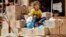 A Syrian refugee girl sits on humanitarian aid boxes, received by her father at Al Zaatri refugee camp in the Jordanian city of Mafraq, near the border with Syria, Sept. 8, 2013.