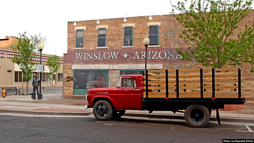 A flatbed Ford truck permanently parked at Standin' on the Corner Park, in Winslow, Arizona, as a tribute to the Eagles song 'Take it Easy,' written by Jackson Browne & Glenn Frey. 