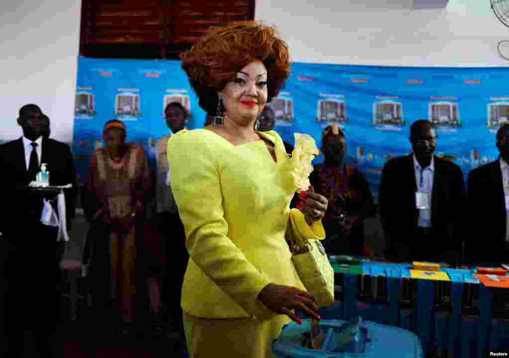 Cameroonian President Paul Biya&#39;s wife, Chantal, casts her ballot at a polling station during the presidential election in Yaounde.
