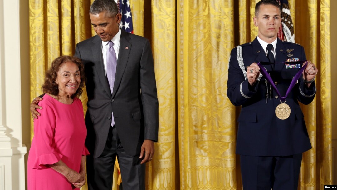 FILE - U.S. President Barack Obama presents actress and director Miriam Colon with the National Medal of Arts during a ceremony at the White House in Washington, Sept. 10, 2015.