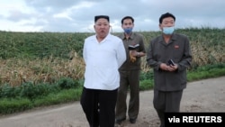 North Korean leader Kim Jong Un inspects the typhoon-damaged area in South Hwanghae Province, North Korea, in this image released by North Korea's Korean Central News Agency (KCNA) on Aug. 27, 2020. 