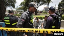 Nicaraguans are detained by immigration police officers in San Jose, Costa Rica, Aug. 19, 2018.