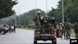 Soldiers aboard a truck patrol during a violent protest by Shiite Muslims demanding the release of their detained leader Ibrahim Zakzaky, July 23, 2019, in Abuja. 