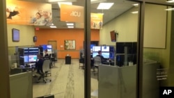 FILE - This June 22, 2015 photo shows Avera Health’s telemedicine hub in Sioux Falls, S.D., that provides medical services to at least 90 hospitals in several states. 