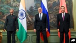 ICAPTION CORRECTS DATE In this photo released by the Russian Foreign Ministry Press Service, India's Foreign Minister S. Jaishankar, left, Russia's Foreign Minister Sergey Lavrov, and China's Foreign Minister Wang Yi, pose for a photo on the…