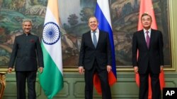 India's Foreign Minister S. Jaishankar, left, Russia's Foreign Minister Sergey Lavrov, and China's Foreign Minister Wang Yi, at a meeting of Foreign Ministers of Shanghai Cooperation Organisation in Moscow, where India and China reached a consensus.