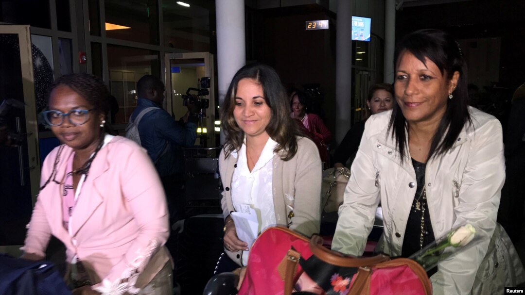FILE - Cuban doctors arrive at the Jomo Kenyatta International Airport amid controversy surrounding their pay in Nairobi, Kenya, June 5, 2018. 