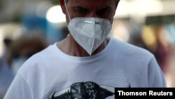 A man wearing a protective face mask is seen outside Las Ventas bullring to show support for bullfighting, following the impact of the COVID-19 outbreak which led to the cancellation of bullfights, in Madrid, Spain, June 13, 2020.