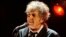 FILE - Bob Dylan performs in Los Angeles, Jan. 12, 2012. 