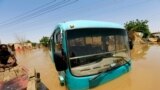 FILE: A bus is seen partially submerged in flood waters near the River Nile, on the outskirts of Khartoum, Sudan. Taken 9.2.2019