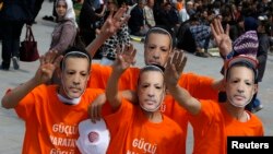 Supporters of the ruling AK Party wear Prime Minister Tayyip Erdogan masks during an election rally in Konya, central Turkey, Mar. 28, 2014. 