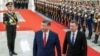 Chinese President Xi Jinping, center, walks with Kyrgyzstan's President Sadyr Japarov during the welcome ceremony at the Great Hall of the People in Beijing, China, Feb. 5, 2025. 