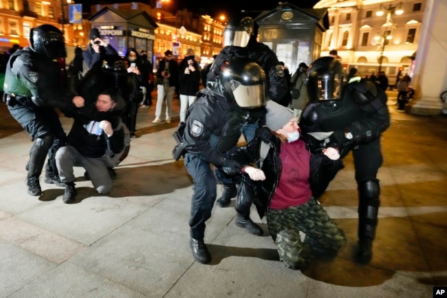 FILE - Riot police detain young people at a demonstration in St. Petersburg, Russia on March 1, 2022. (AP Photo, File)