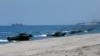 Amphibious Assault Vehicles, AAVs, carrying American and Philippine troops, make a beach landing during the Joint US-Philippine Military Exercise dubbed "Balikatan 2019" Thursday, April 11, 2019, off San Antonio, Philippines.