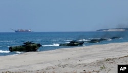 Amphibious Assault Vehicles carrying U.S. and Philippine troops, make a beach landing during the Joint US-Philippine Military Exercise dubbed "Balikatan 2019" April 11, 2019, off San Antonio, Zambales province northwest of Manila, Philippines.