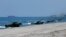 Amphibious Assault Vehicles, AAVs, carrying American and Philippine troops, make a beach landing during the Joint US-Philippine Military Exercise dubbed "Balikatan 2019" Thursday, April 11, 2019, off San Antonio, Philippines.