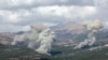 Smoke rises from Jabal al-Rihan as pictured from Marjayoun