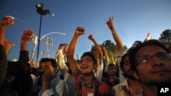 FILE - Supporters of Tahrir-ul Qadri in Islamabad.