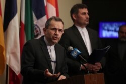 FILE - Iranian Ambassador to the United Nations Majid Takht Ravanchi speaks to the media outside Security Council chambers at the U.N. headquarters in New York, June 24, 2019.