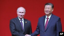 Umongameli wele China uMnu. Xi Jinping lomongameli Vladimir Putin wakwele Russia.