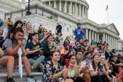 Crowds that attended a sit-in at Capitol Hill listen to Rep. Cori Bush, D-Mo., after it was announced that the Biden administration will enact a targeted nationwide eviction moratorium outside of Capitol Hill in Washington on Aug. 3, 2021.