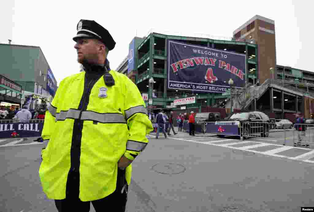 Boston police officer Brian Lundy directs pedestrian traffic outside of Fenway Park before game one of the MLB baseball World Series between the St. Louis Cardinals and Boston Red Sox. Mandatory Credit: Robert Deutsch-USA TODAY Sports