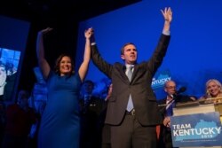 Democratic gubernatorial candidate and Kentucky Attorney General Andy Beshear, along with lieutenant governor candidate Jacqueline Coleman, acknowledge supporters at the Kentucky Democratic Party.