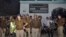 Local police stand outside a house where a suspected militant is said to be hiding in Thakurganj area in Lucknow, India, March 7, 2017. 