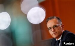FILE - German Foreign Minister Heiko Maas attends the weekly cabinet meeting in Berlin, Germany, July 31, 2019.