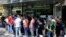 People line up in front of a currency exchange shop to buy U.S. dollars and euros, in downtown Tehran, Iran, Sept. 5, 2018. The Iranian rial fell Wednesday to its lowest rate on record and saw worried residents of Tehran line up outside of beleaguered moneychangers, part of a staggering 140-percent drop in the currency's value since America pulled out of the nuclear deal four months ago.
