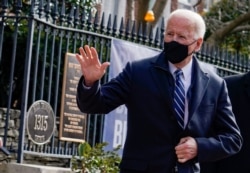 FILE - U.S. President Joe Biden departs Holy Trinity Catholic Church on his first Sunday as president, in Washington, Jan. 24, 2021.