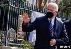 FILE - U.S. President Joe Biden departs Holy Trinity Catholic Church on his first Sunday as president, in Washington, Jan. 24, 2021.