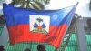 FILE - Workers place flags on a wall at the National Palace in the Haitian capital Port-au-Prince, on Feb. 6, 2017.