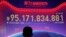 A giant screen showing total sales transacted by e-commerce giant Alibaba on the "Singles' Day," a global online shopping festival in Shenzhen, southern China's Guangdong province, Nov. 11, 2016. 