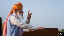Indian Prime Minister Narendra Modi addresses the gathering during Independence Day celebrations at the historic 17th century Red Fort in New Delhi, India, on Sunday, Aug. 15, 2021. Modi on Sunday delivered an Independence Day speech that…