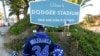 A person stands outside Dodger Stadium after the death of former Dodgers pitcher Fernando Valenzuela, in Los Angeles, Oct. 23, 2024.