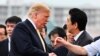 U.S. President Donald Trump, left, shakes hands with Japan's Prime Minister Shinzo Abe, as he leaves the Japanese destroyer JS Kaga, in Yokosuka, south of Tokyo Tuesday, May 28, 2019. 