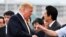 U.S. President Donald Trump, left, shakes hands with Japan's Prime Minister Shinzo Abe, as he leaves the Japanese destroyer JS Kaga, in Yokosuka, south of Tokyo Tuesday, May 28, 2019. 