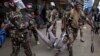 FILE - Anti-riot police officer arrest a suspected protester during a demonstration against the government in Nairobi, Kenya, Aug. 8, 2024.