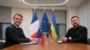 FILE - FILE PHOTO: France's President Emmanuel Macron and Ukraine's President Volodymyr Zelenskiy pose ahead of a meeting in Brussels, Dec. 18, 2024. France is hosting European leaders for talks on Ukraine Feb. 17, 2025.