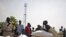 Southern Sudanese who recently returned from northern Sudan receive food rations from the World Food Program in the southern capital of Juba on Friday, Jan. 7, 2010.