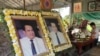 Two side-by-side portraits of social analyst Kem Ley are on display at his hometown in Takeo province, Cambodia, July 02, 2017. (Hul Reaksmey/VOA Khmer)