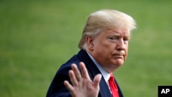 President Donald Trump waves as he walks to the Marine One helicopter after speaking to the media, Nov. 20, 2019, as he leaves the White House in Washington, en route to Texas. 