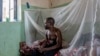 FILE - A man suffering from mpox waits for treatment at the Kamituga General Hospital in South Kivu, Congo, on Sept. 4, 2024.