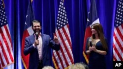 Donald Trump, Jr., left, and Trump campaign senior advisor Kimberly Guilfoyle, right, speak to supporters of President Donald Trump during a panel discussion, Oct. 15, 2019, in San Antonio. 