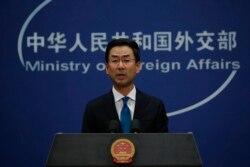 FILE - Chinese Foreign Ministry spokesman Geng Shuang speaks during a daily briefing at the Ministry of Foreign Affairs office in Beijing, Nov. 28, 2019.