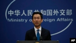 FILE - Chinese Foreign Ministry spokesman Geng Shuang speaks during a daily briefing at the Ministry of Foreign Affairs office in Beijing, Nov. 28, 2019.