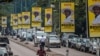 Billboards of Uganda's President Yoweri Museveni who is running for his 6th presidential term are seen on a street in Kampala, Jan. 4, 2021.